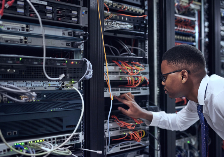 Cropped shot of a IT technician working and checking if all the servers are up and running