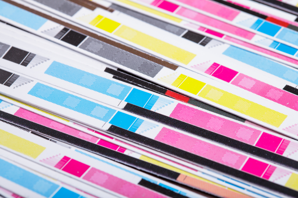 CMYK color on printed sheets of paper after cutting