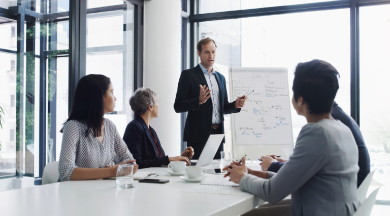 Shot of a mature businessman giving a presentation to his colleagues in a boardroom