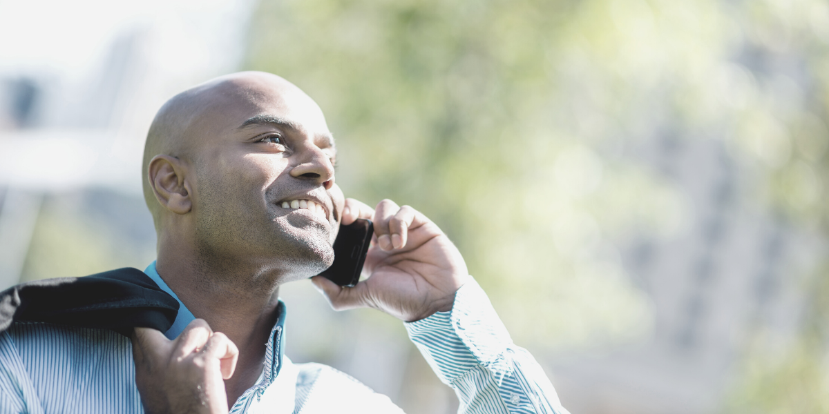 happy businessman on phone