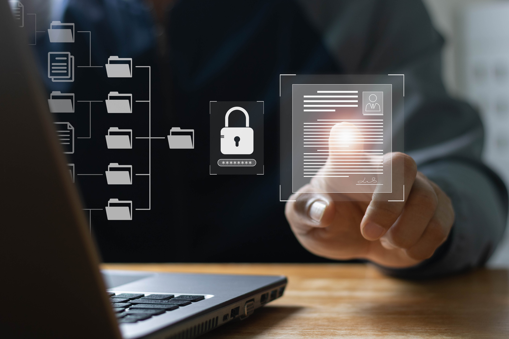 Close up of icons of a file structure in front of a laptop with a lock icon preventing access to signify Managed IT services