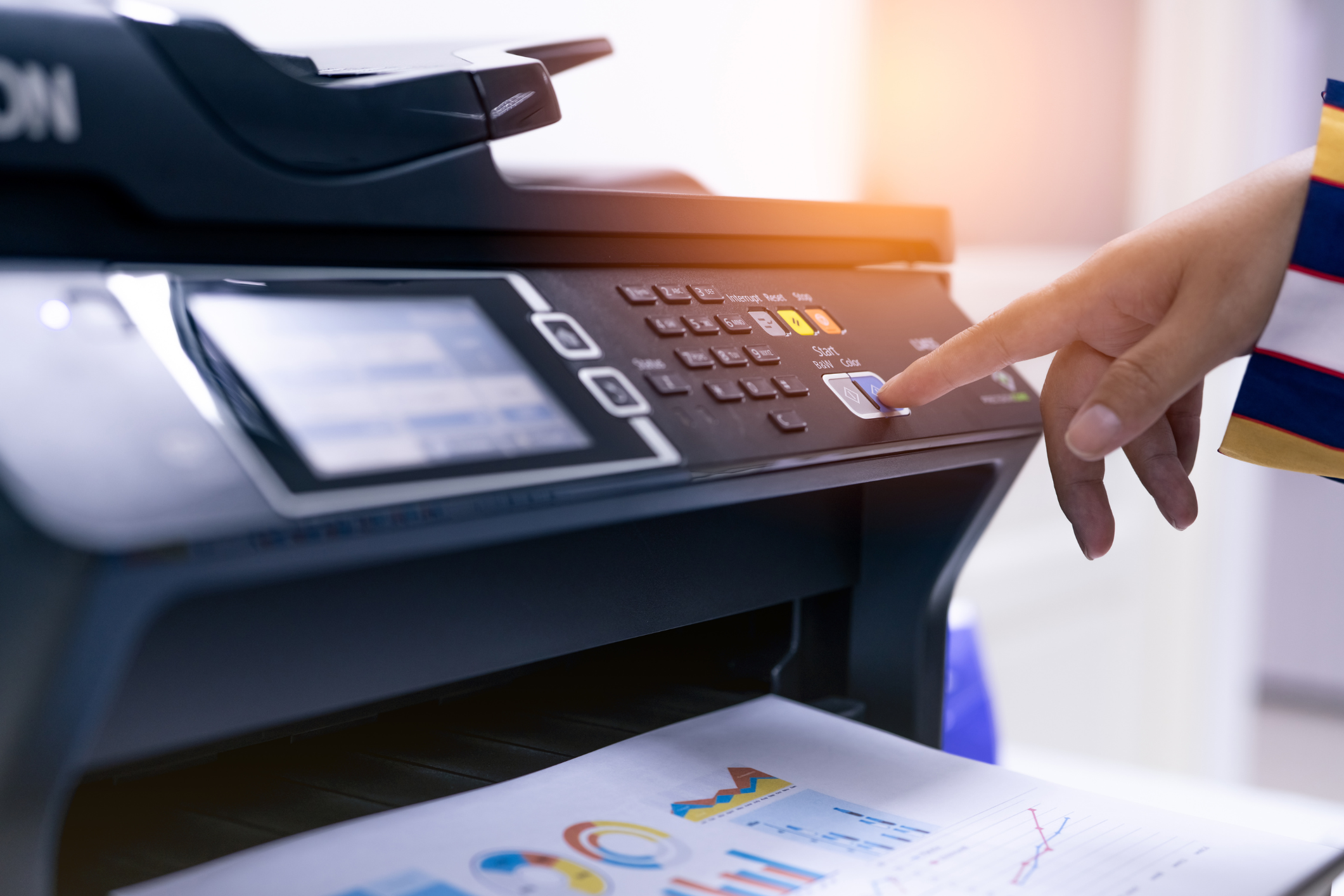 Close up of someone using the interface on an office printer