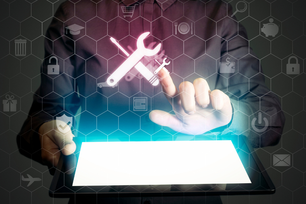 An icon of a wrench and flathead screwdriver above a tablet signifying copier service.