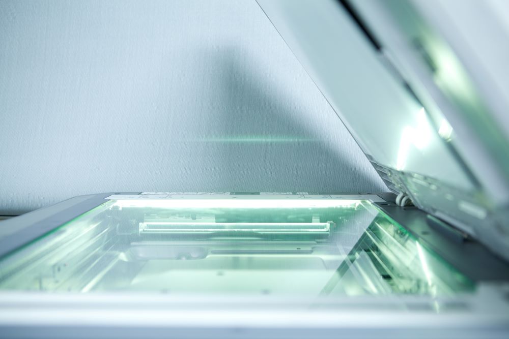 Close up a scanner to conceptualize document scanning.